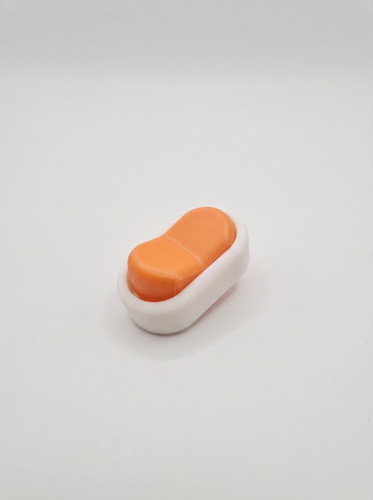 Interruptor fidget 3D naranja y blanco