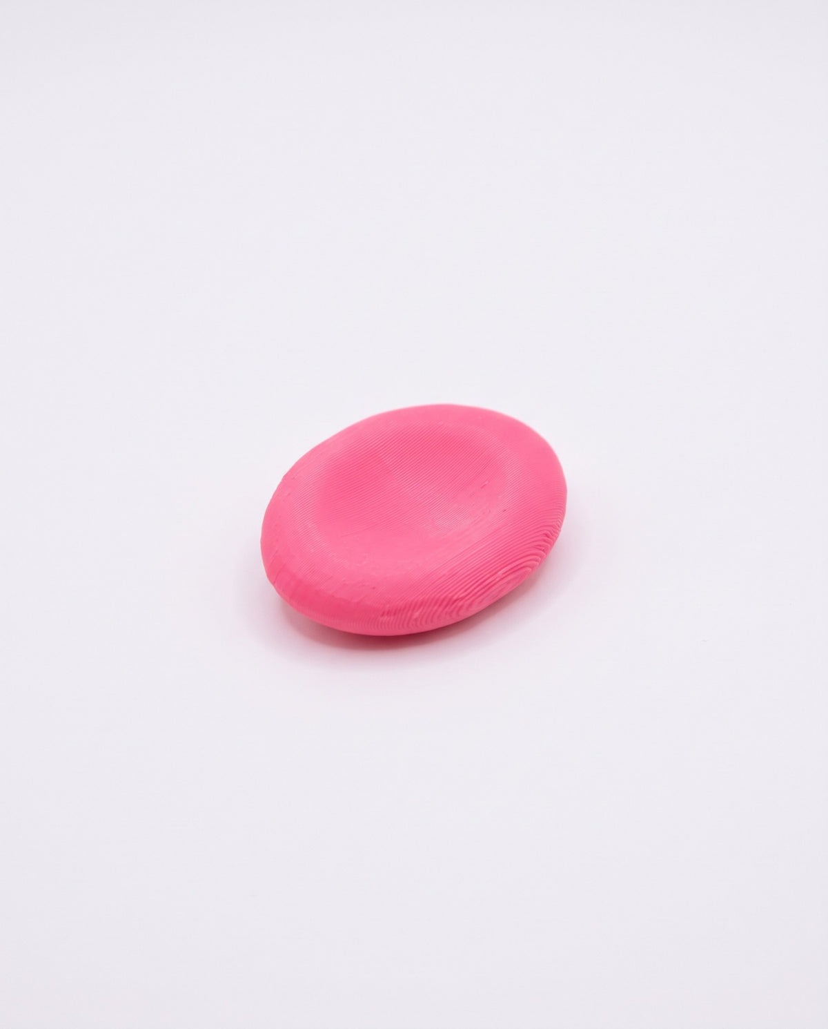 Piedra sensorial 3D fucsia para el pulgar