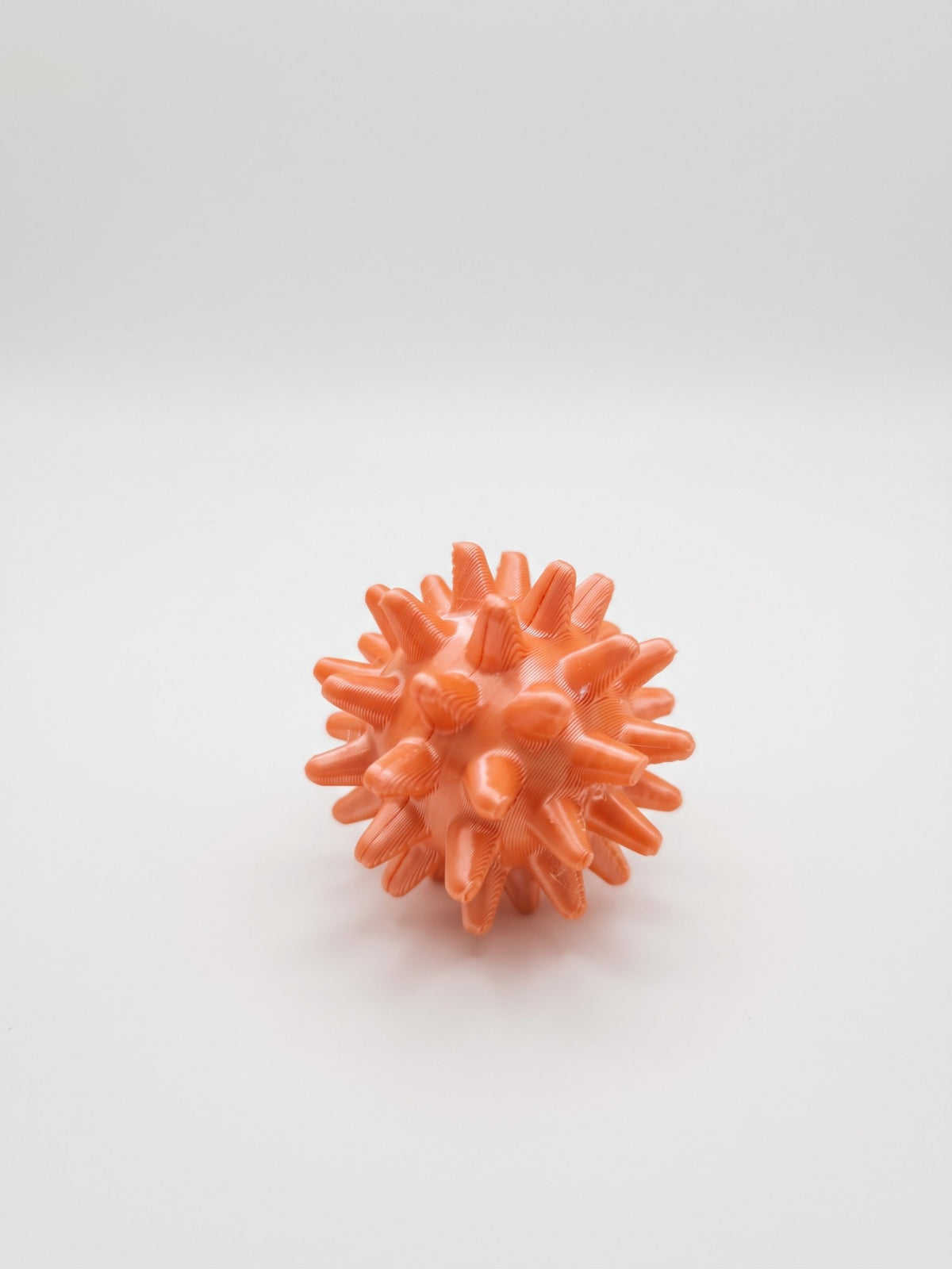 Bolita sensorial con púas 3D naranja