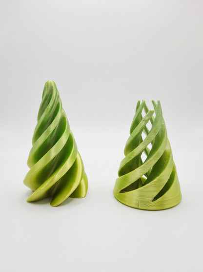 Conos espiral 3D verdes, uno de pie y otro con las láminas abiertas