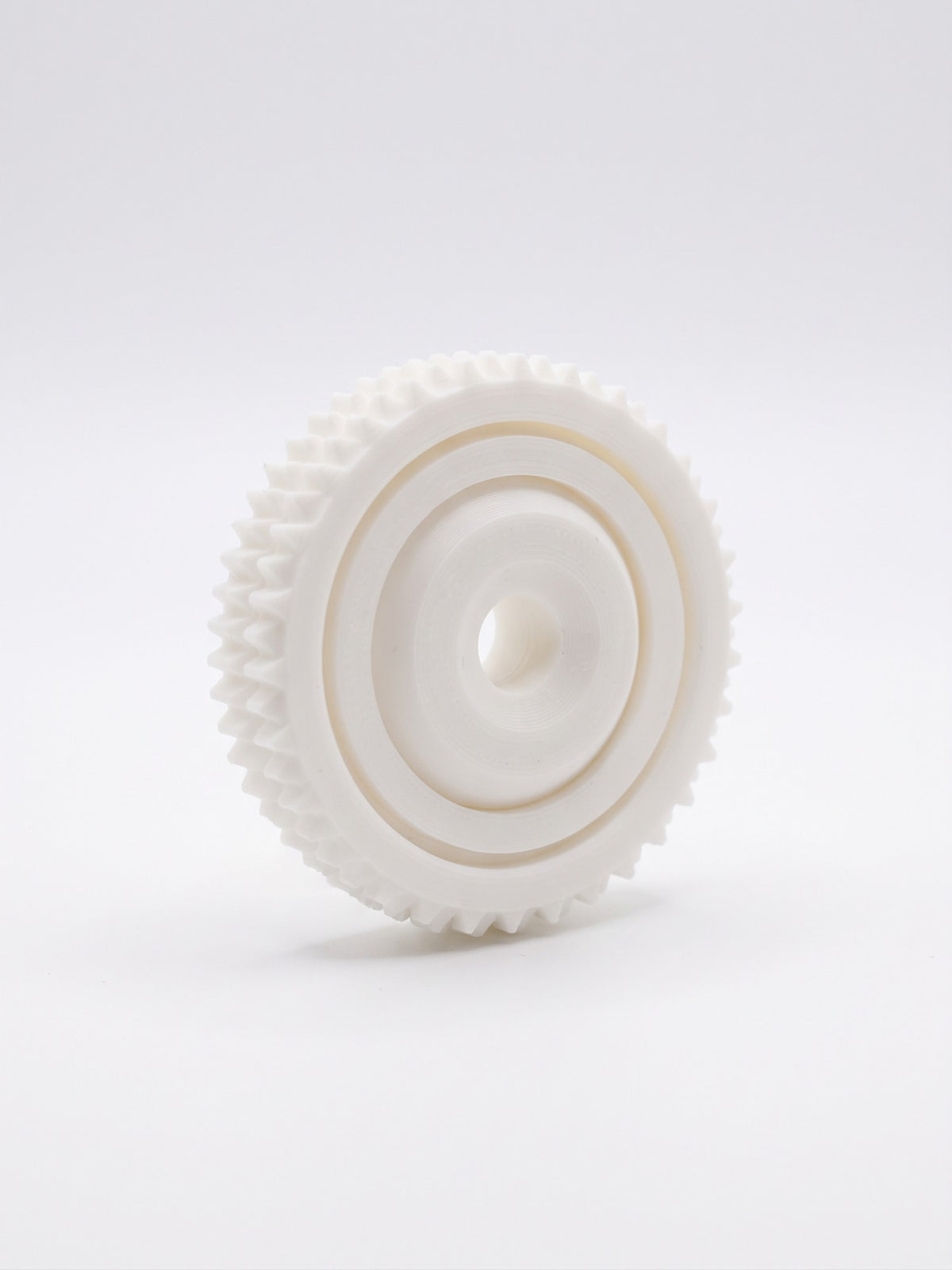 Disco sensorial giratorio 3D blanco con borde dentado