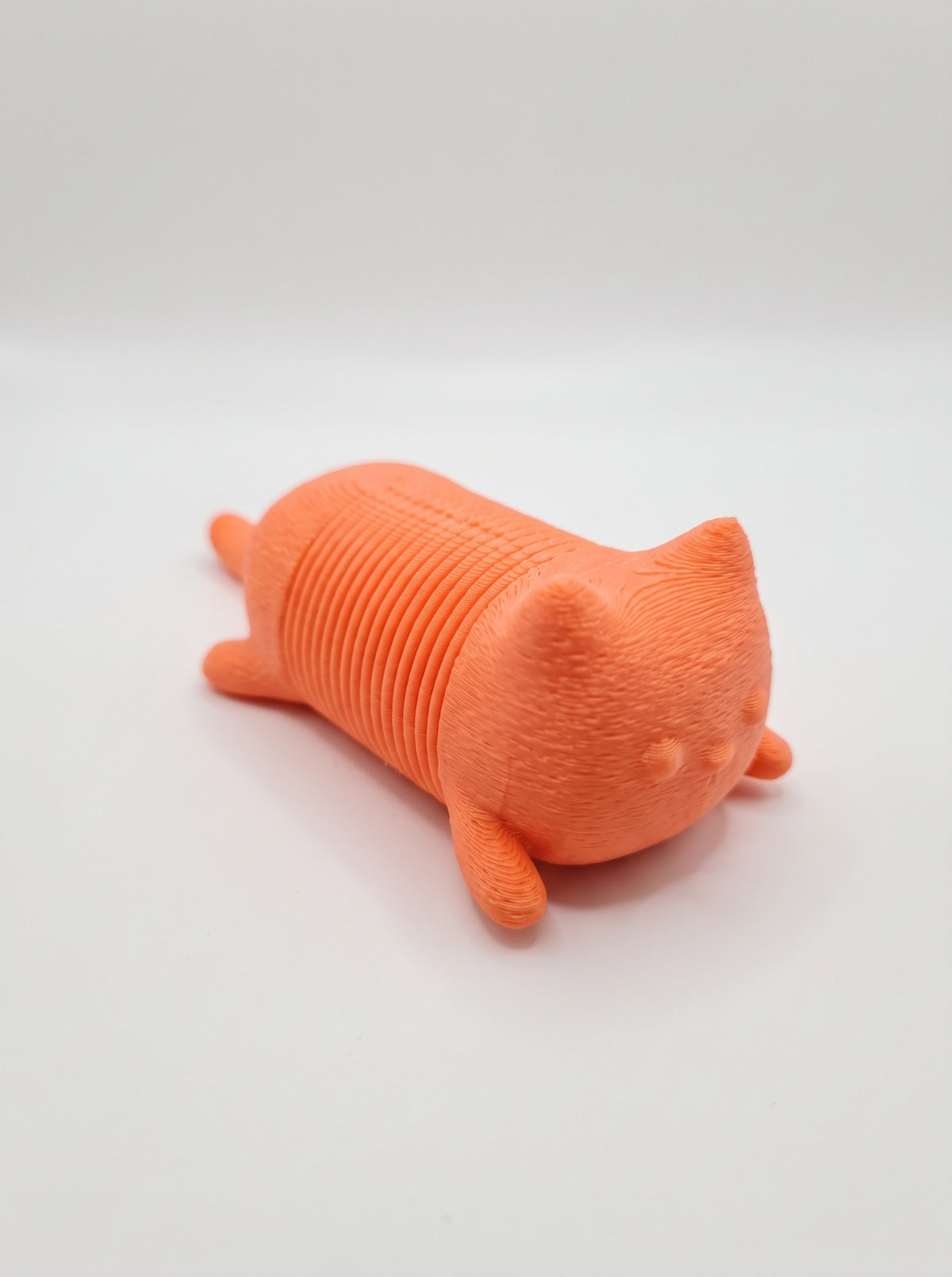 Gato resorte 3D naranja fidget slinky