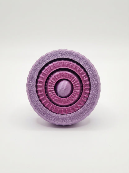 Giroscopio 3D texturizado visto de frente con anillos de colores