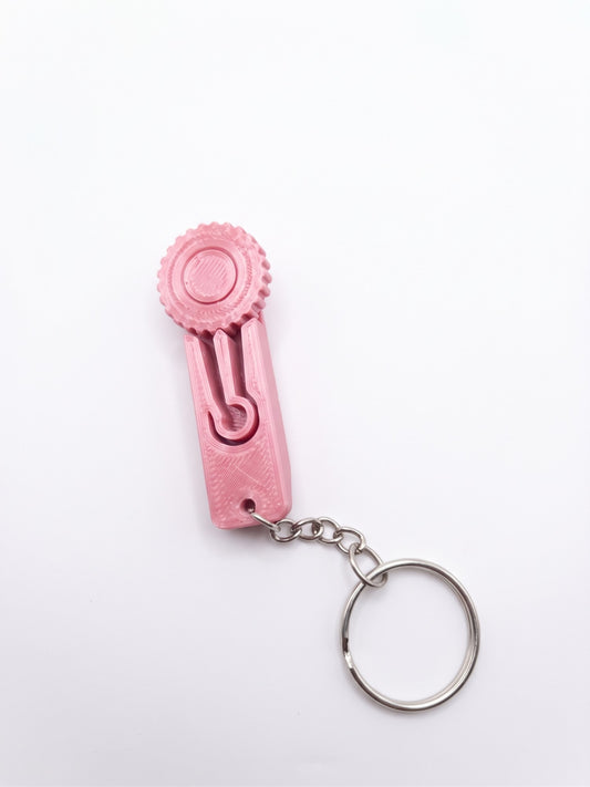 Llavero clicker 3D rosado con perilla giratoria