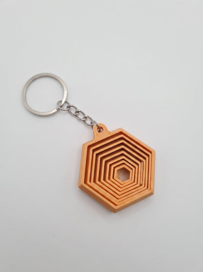 Llavero hexágono 3D naranja de capas encajadas
