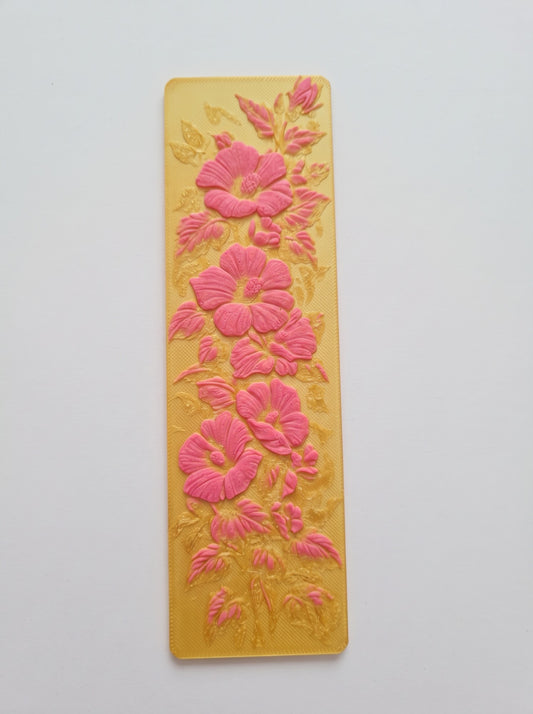 Marcapáginas 3D amarillo con flores rosadas en relieve