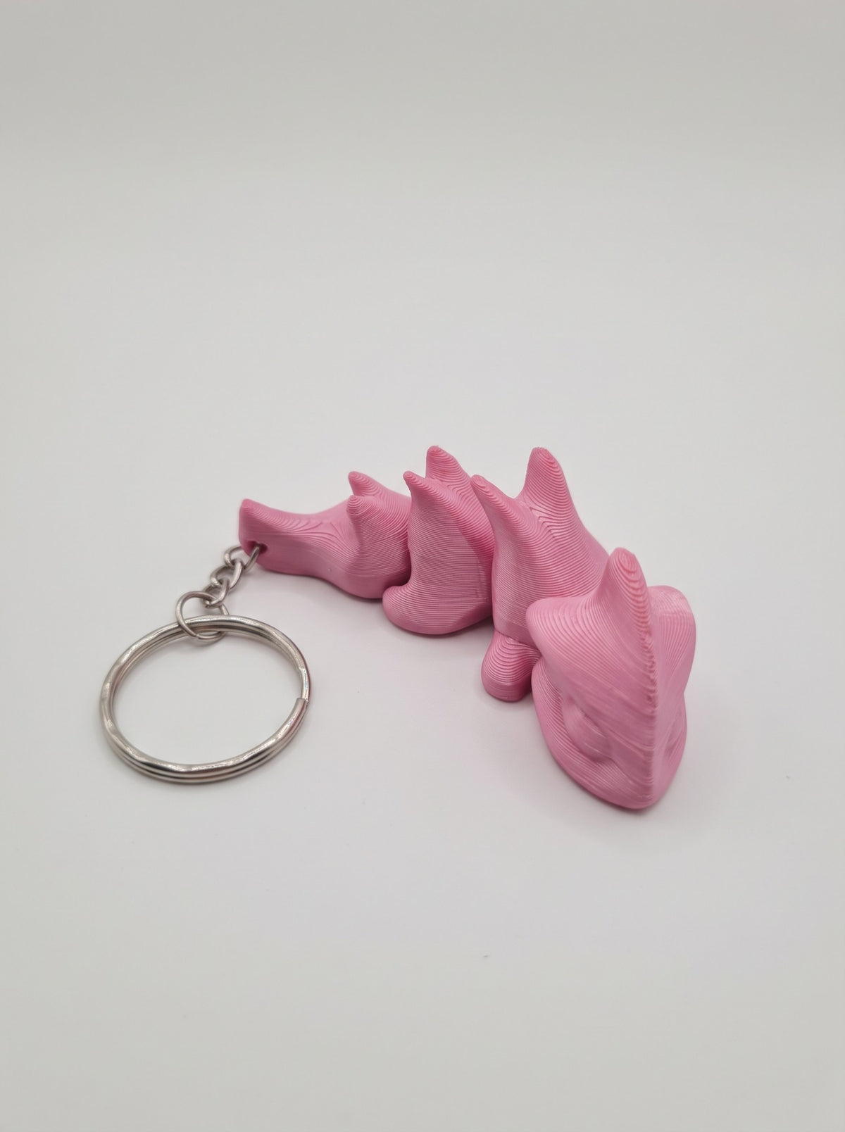 Mini dragón articulado 3D rosado, llavero