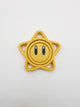 Spinner estrella 3D amarilla con carita